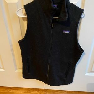 Woman’s medium Patagonia sweater vest . Charcoal / black